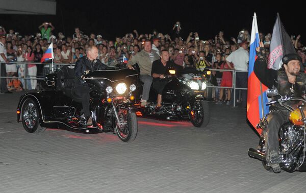 Russian Prime Minister Vladimir Putin at a bike festival  - Sputnik International
