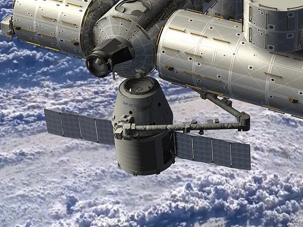 Artist rendering of SpaceX Dragon spacecraft delivering cargo to the International Space Station - Sputnik International