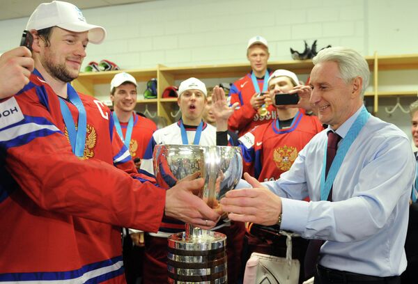 Russian team head coach Zinetula Bilyaletdinov drinks from the cup after Russia's victory over Slovakia at the world hockey championships - Sputnik International
