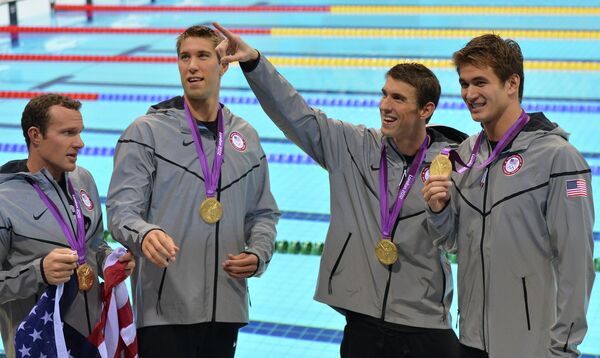 Michael Phelps won his 18th Olympic gold medal in his final competitive appearance Saturday to help the United States to the 4x100 medley relay at the London Games. - Sputnik International