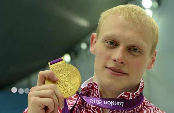 Ilya Zakharov of Russia took diving gold in the men’s three-meter springboard - Sputnik International
