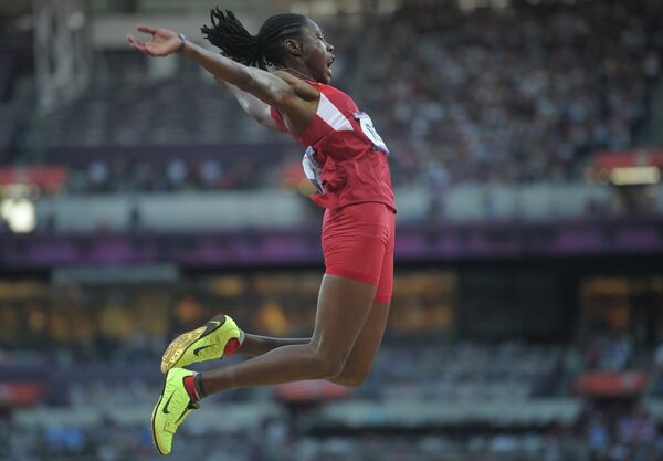 Brittney Reese leaped 7.12 meters to win Olympic gold in the women's long jump - Sputnik International
