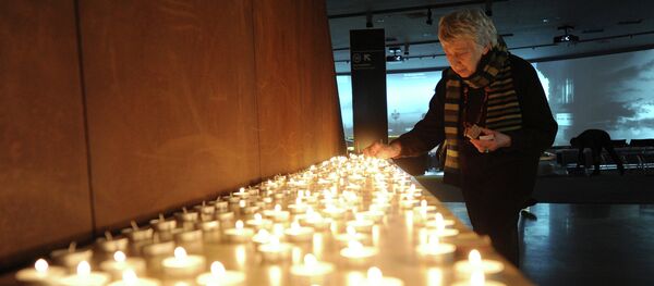 Ceremony of candle lightening in the Holocaust victims memorial. - Sputnik International