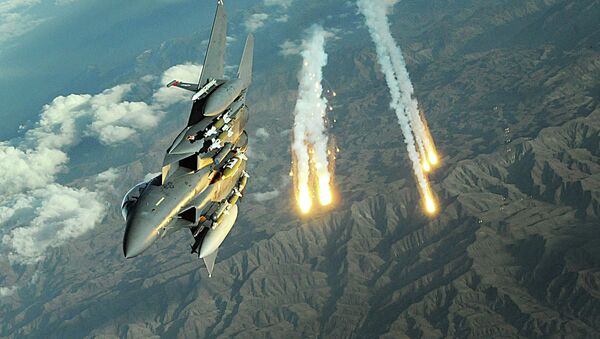 An F-15E Strike Eagle deploys flairs during a mission over Afghanistan - Sputnik International