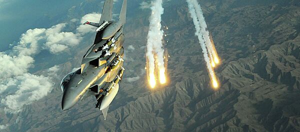 An F-15E Strike Eagle deploys flairs during a mission over Afghanistan An F-15E Strike Eagle deploys flairs during a mission over Afghanistan - Sputnik International