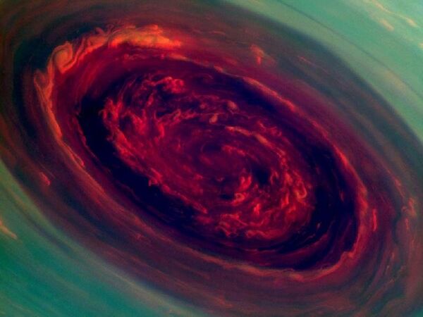 A color-enhanced image shows the eye of the massive storm on Saturn. - Sputnik International