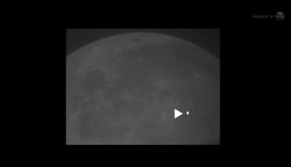 This still from a NASA video shows the point of impact on the moon on March 17. - Sputnik International
