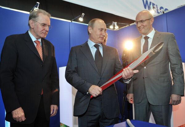Russian President Vladimir Putin with Olympic torch - Sputnik International