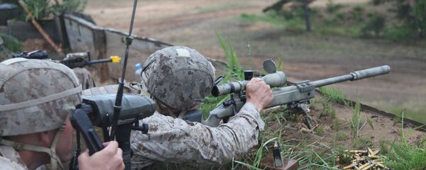 A US Marine takes aim at a long range target at the live fire range on Base Camp Adazi, Latvia on June 15, 2012 A US Marine takes aim at a long range target at the live fire range on Base Camp Adazi, Latvia on June 15, 2012 - Sputnik International