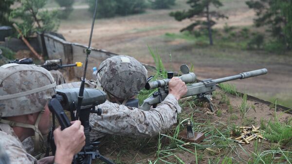 A US Marine takes aim at a long range target at the live fire range on Base Camp Adazi, Latvia on June 15, 2012 - Sputnik International