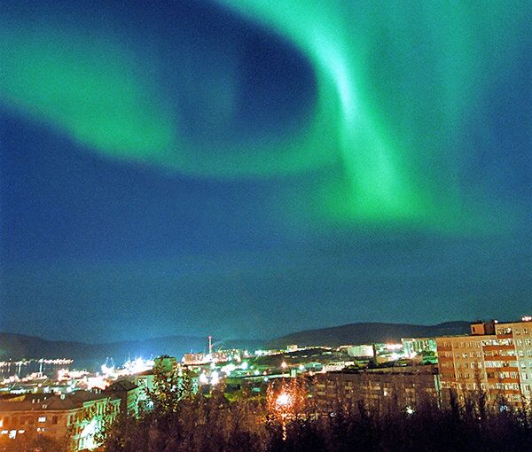The Northern Lights are a by-product of a space storm. Here, they light up the skies over Murmansk, Russia. - Sputnik International