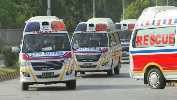 Ambulances carry bodies of foreign tourists killed by unidentified gunmen at the base camp of the Nanga Parbat mountain, June 23, 2013 - Sputnik International