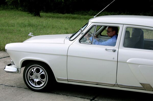 Russian President Vladimir Putin driving a 1956 Gaz-21 Volga built at the opening of the Adler-Krasnaya Polyana tunnel near Sochi in 2005. Russian President Vladimir Putin driving a 1956 Gaz-21 Volga built at the opening of the Adler-Krasnaya Polyana tunnel near Sochi in 2005. - Sputnik International
