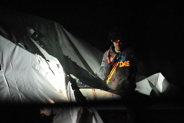 A sniper aims a laser on Dzhokhar Tsarnaev's head on the night of his arrest on April 19. - Sputnik International
