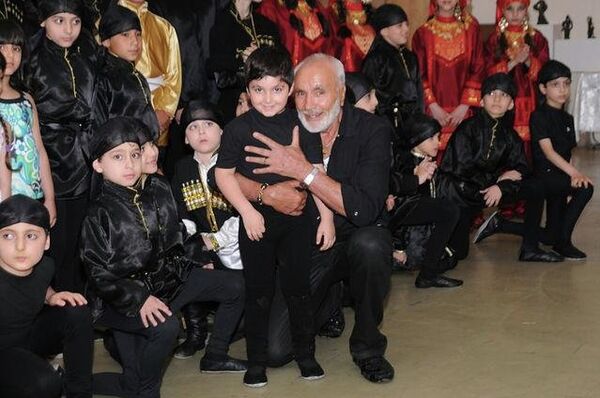 Anatoliy poses with some of his youngest dancers after a recent performance in New York. Anatoliy poses with some of his youngest dancers after a recent performance in New York. - Sputnik International