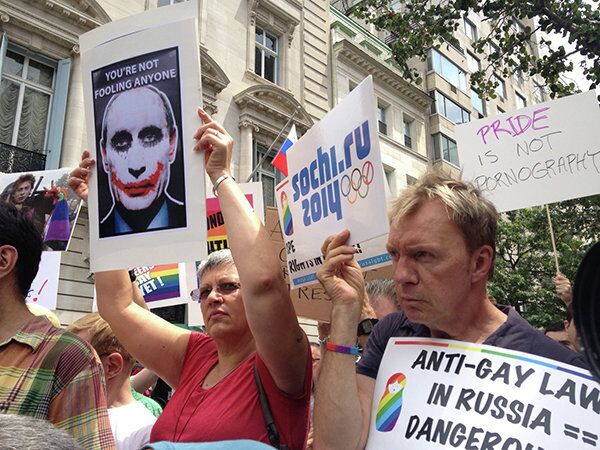 Signs mocking Putin were displayed at a gay rights rally outside the Russian Consulate in New York City on July 31. - Sputnik International