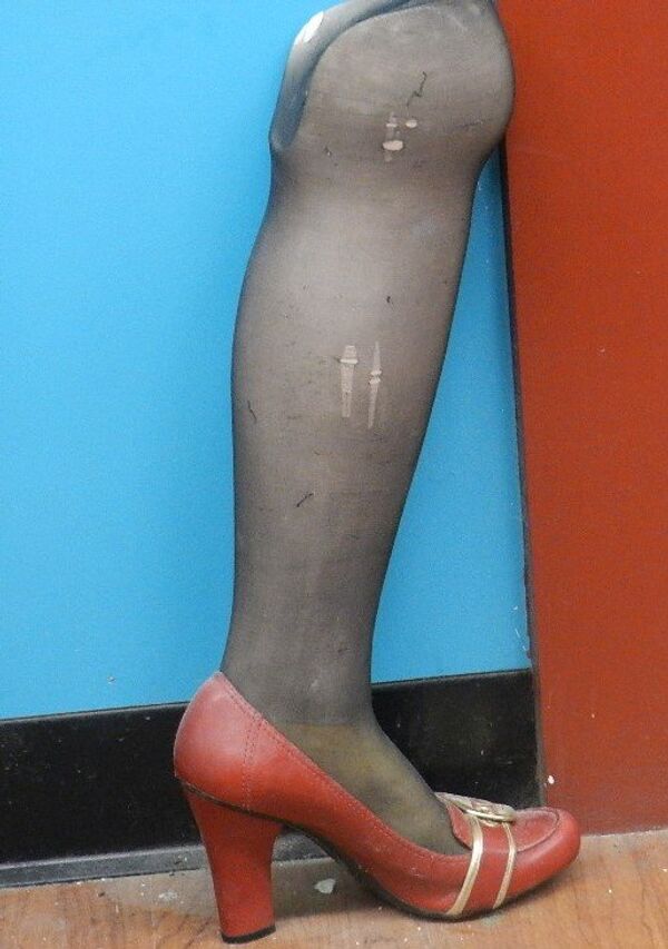 The prosthetic leg Irina once wore stands in a corner of the bakery. The prosthetic leg Irina once wore stands in a corner of the bakery. - Sputnik International