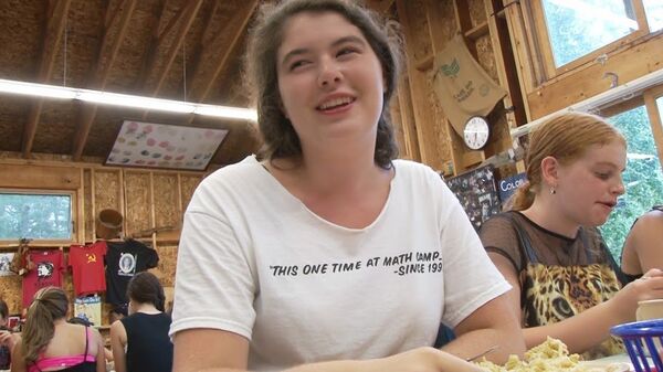 Russian School of Math summer camp counselor Casey Vivens having dinner with the campers in her care. Russian School of Math summer camp counselor Casey Vivens having dinner with the campers in her care. - Sputnik International