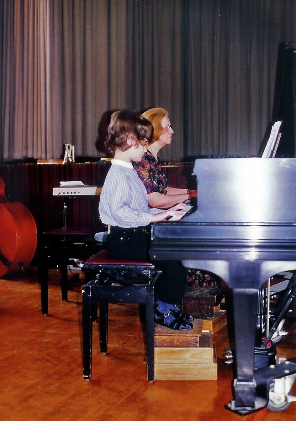 Five-year-old Anton Sviridenko plays his first piano recital with his teacher from the Perkins School for the Blind, Adele Trytko, who taught him for 14 years. - Sputnik International