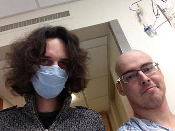 Russian astrophysicist Anton Buslov (right) is pictured with a friend during his cancer treatment. - Sputnik International