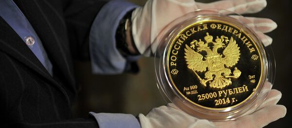 Mises Institute contributor Marcia Christoff-Kurapovna believes now is the perfect time for Russia to introduce a gold-based currency. Mises Institute contributor Marcia Christoff-Kurapovna believes now is the perfect time for Russia to introduce a gold-based currency. - Sputnik International