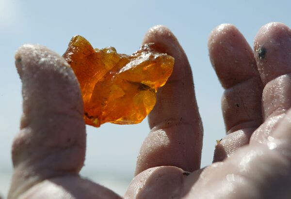 Amber is a translucent material made from fossilized resin, typically of orange or yellow hue - Sputnik International