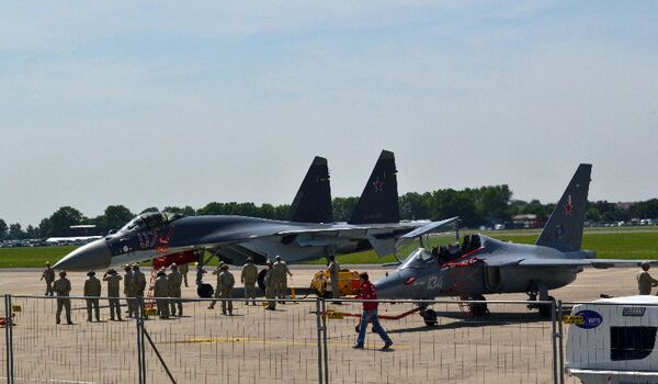 There has been great interest from foreign buyers in the new Su-35 heavy jet fighter (left) and the lightweight Yak-130 fighter (right) - Sputnik International