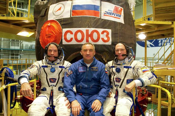 Steven Swanson, Alexander Skvortsov and Oleg Artemyev - Sputnik International