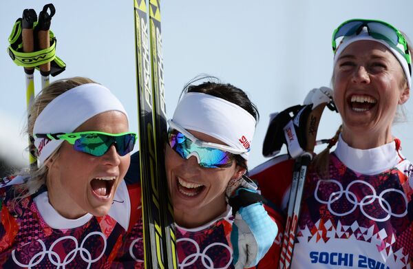 Norway's cross-contry skiers Therese Johaug, Marit Bjoergen and Kristin Stoermer Steira - Sputnik International