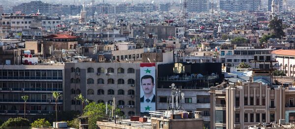 A portrait of Syrian president Bashar al-Assad on the wall of a building in central Damascus (File) - Sputnik International
