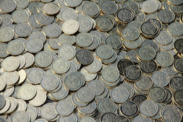 A physical representation of the Bitcoin for collectors. The currency exists only online. A physical representation of the Bitcoin for collectors. The currency exists only online. - Sputnik International