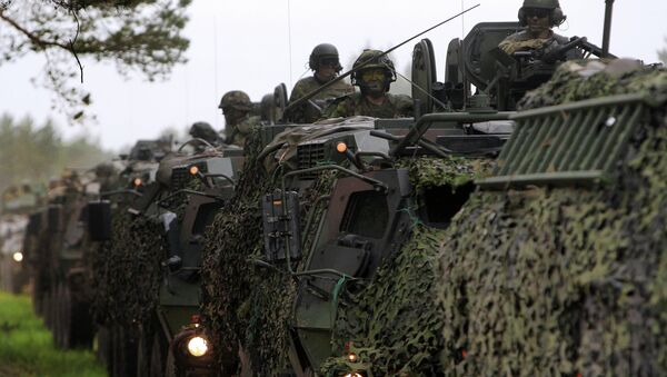 U.S., Estonian, Latvian, Lithuanian, and British soldiers conduct a convoy into the field training portion of Saber Strike 2013 in Adazi, Latvia, June 10, 2013. - Sputnik International