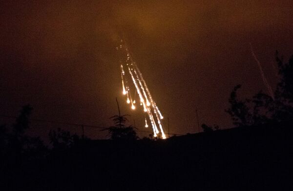 Ukrainian soldiers shoot at the village of Semyonovka with phosphorus shells - Sputnik International
