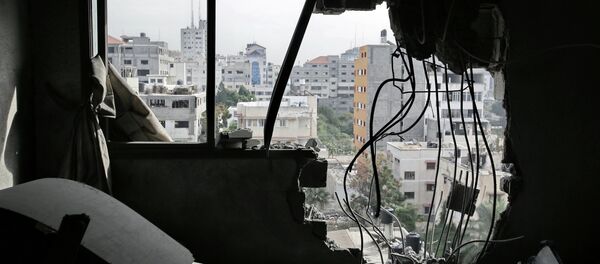 International Human Rights Agency Amnesty International (AI) issued a statement condemning the destruction of multistory buildings in Gaza by airstrikes during Israel's Operation Protective Edge in August and said it was a deliberate act that amounts to war crimes. - Sputnik International
