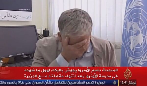 Video screenshot. Press-Secretary for UN Near East Agency Bursts Into Tears During Interview - Sputnik International