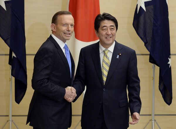 Australian Prime Minister Tony Abbott, left, and his Japanese counterpart Shinzo Abe shake hands prior to a National Security Council meeting at the latter's official residence in Tokyo. - Sputnik International