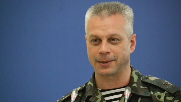 Andriy Lysenko, a spokesperson for the Ukrainian Council of National Security and Defense, during a press briefing in Kiev - Sputnik International