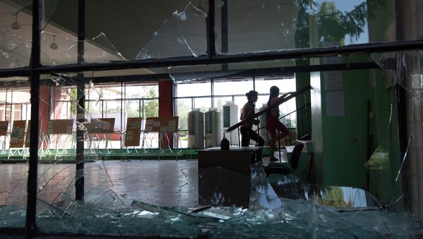 A broken window at the school, which suffered from shelling in Donetsk region - Sputnik International