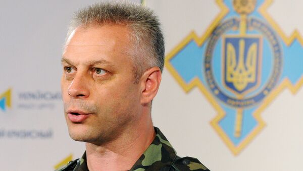 Andriy Lysenko, a spokesperson for the Ukrainian Council of National Security and Defense, during a press briefing in Kiev. - Sputnik International