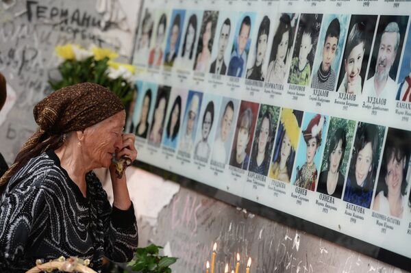 A woman cries during a commemorative event marking 10 years since the Beslan school siege at the memorial to the victims of the terrorist attack on September 1, 2004. A woman cries during a commemorative event marking 10 years since the Beslan school siege at the memorial to the victims of the terrorist attack on September 1, 2004. - Sputnik International