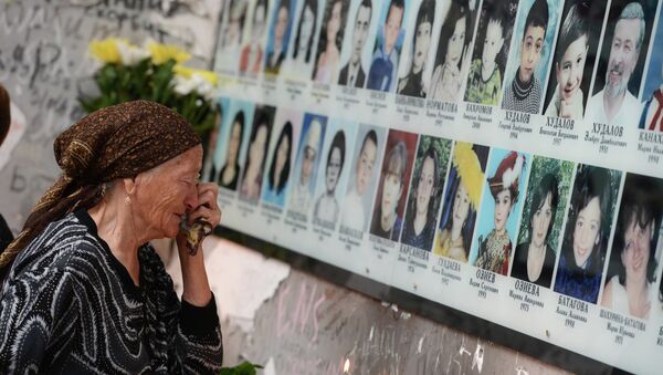 A woman cries during a commemorative event marking 10 years since the Beslan school siege at the memorial to the victims of the terrorist attack on September 1, 2004. - Sputnik International