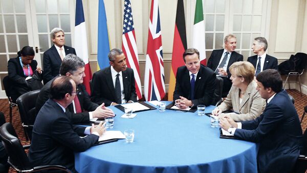 Western leaders sitting at the round table during a meeting of NATO summit in Wales in September 201. - Sputnik International