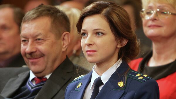 Crimean Prosecutor General Natalya Poklonskaya (center) has revealed that Kiev's hostility to her appointment last March included death threats and threats of jail time. - Sputnik International