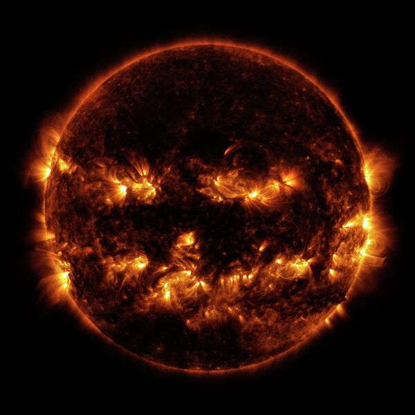 On October 8, 2014 active regions on the sun gave it the appearance of a jack-o'-lantern. This image is a blend of 171 and 193 angstrom light as captured by the Solar Dynamics Observatory. - Sputnik International