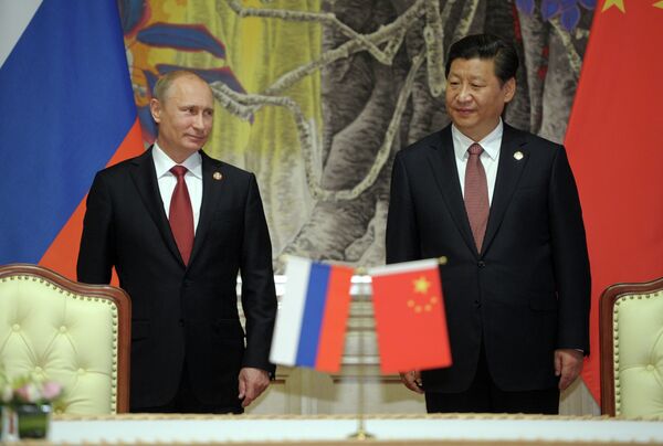 Russia's President Vladimir Putin (left) with China's President  Xi Jinping (right) - Sputnik International