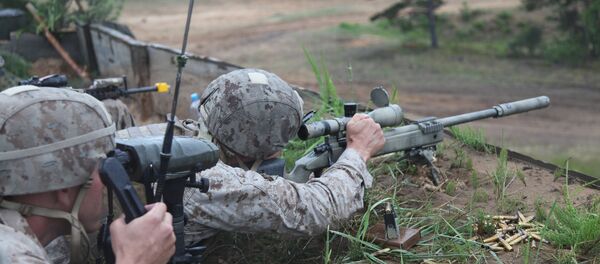 A US Marine takes aim at a long range target at the live fire range on Base Camp Adazi, Latvia on June 15, 2012 A US Marine takes aim at a long range target at the live fire range on Base Camp Adazi, Latvia on June 15, 2012 - Sputnik International